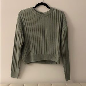 A green H&M sweater